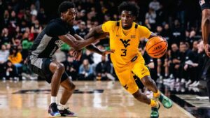 D.J. Thomas nails two big shots, WVU erases a 14-point deficit to beat Cincinnati on the road